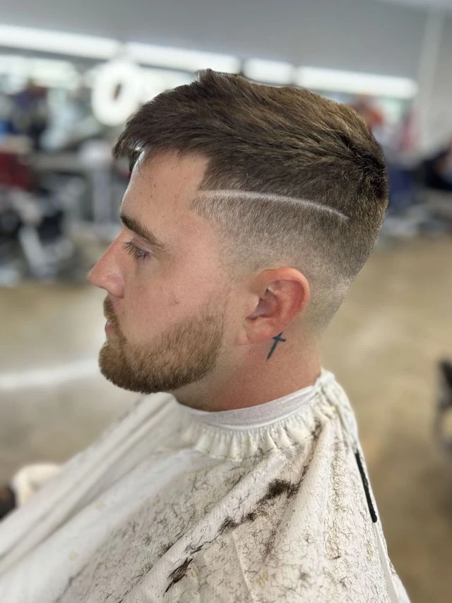 Side profile showing a short haircut, shaved part, and neatly shaped beard from Norie’s Booksy portfolio